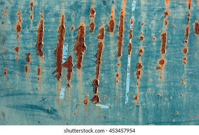 Corroded blue metal background with rusty scratches. Industrial, urban deteriorated texture.
