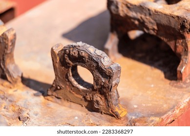 Corroded cargo securing (lashing) eye, on deck of container ship.