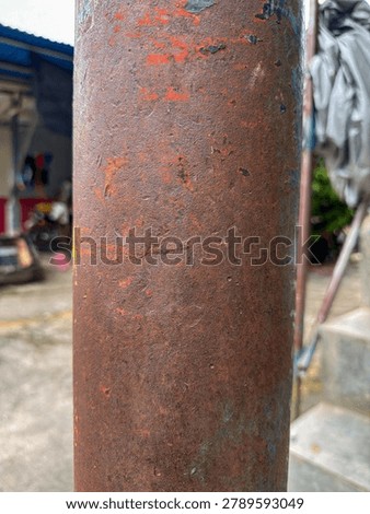 Corroded cylindrical form showcasing the vibrant and textured artistry of advanced metal decay