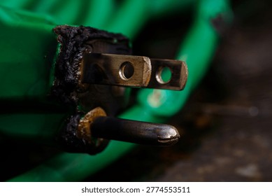 Corroded damaged plug representing shock hazard, electrical failure, unsafe equipment, and residential safety inspection.