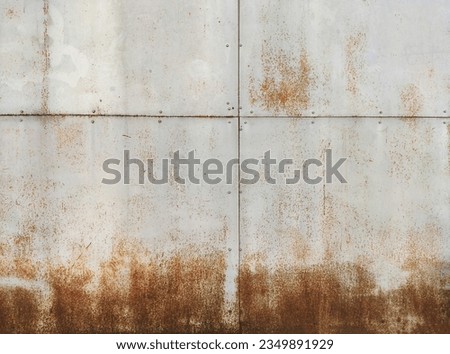 Corroded metal background. Rusted blue painted metal wall. Rusty metal background with streaks of rust. Rust stains. The metal surface rusted spots. Rystycorrosion.