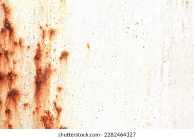 Corroded metal background. Rusted white painted metal wall. Rusty metal background with streaks of rust. Rust stains. The metal surface rusted spots. Rystycorrosion.                    