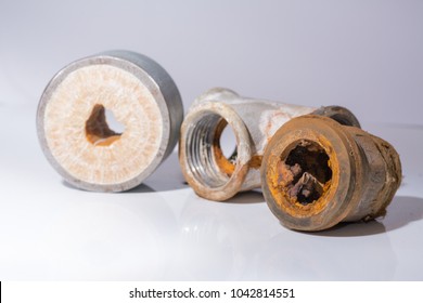 corrosion and calcified water tubes and adapters isolated on white background
