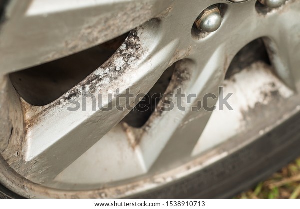 Corrosion of car rims. Peeling\
paint from metal. Chemical reaction. Disk recovery. Prolonged\
use.