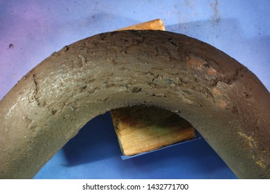 Corrosion and cracking of 2" carbon steel tubing, likely cause is stress corrosion cracking