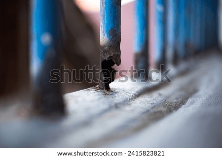 Corrosion on iron fence. Rusty metal fence. Steel pipes rust. The old metal structure got rust on surface and almost damage. Iron fence beginning to corrode. Old rusty fence.
