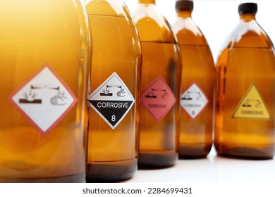The corrosive chemical symbol on the bottle, dangerous chemicals in industry or laboratory - Shutterstock ID 2284699431