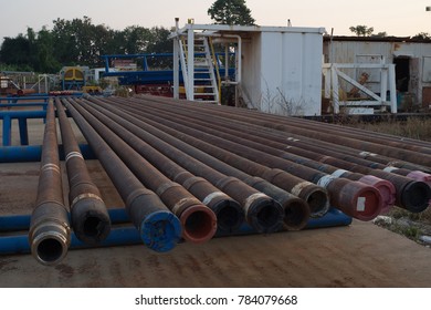 Corrosive pipe thread with rust that prepare for repair by lathe machine,Drillpipe on the rack.
