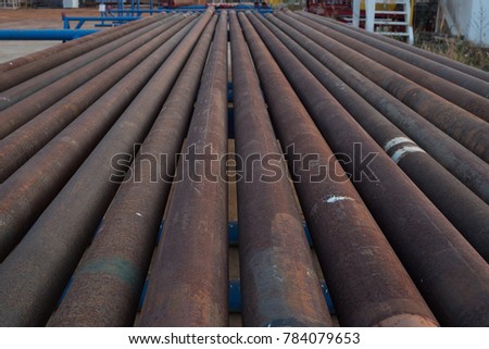 Corrosive pipe thread with rust that prepare for repair by lathe machine,Drillpipe on the rack.