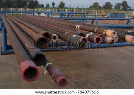 Corrosive pipe thread with rust that prepare for repair by lathe machine,Drillpipe on the rack.