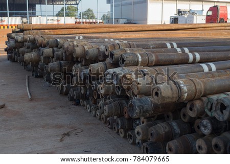 Corrosive pipe thread with rust that prepare for repair by lathe machine,Drillpipe on the rack.
