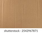corrugated cardboard box outer layer surface background, brown kraft paper with rough fibrous texture, matte neutral tone backdrop wallpaper