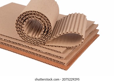 Corrugated cardboard layer pads and flexible singleface corrugated paper in roll isolated on white. Environmentally friendly paper packaging. Packaging for safe transportation - Shutterstock ID 2075229295