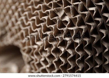 Corrugated cardboard roll as background, closeup. Packaging material