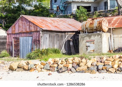 Corrugated Hut With Oil Storage Drum, Beach By Pambula River Estuary, New South Wales, Australia