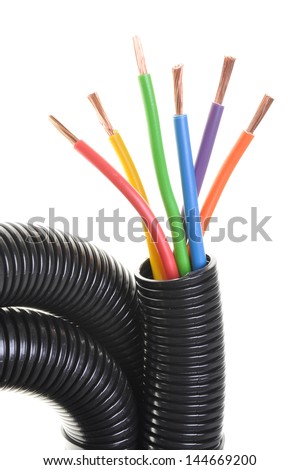 Corrugated pipe withe cables isolated on white background