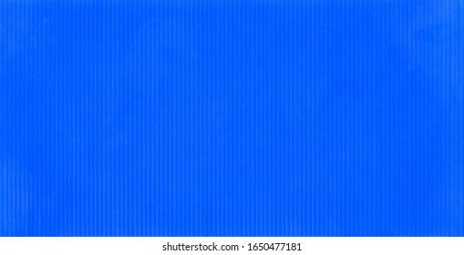 Corrugated Plastic Sheet Or PP Flute Board (polypropylene Board). Blue Background With Stripe Effect.