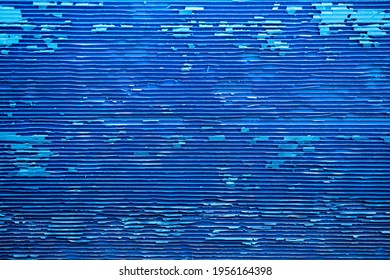 Corrugated Plastic Sheet Or PP Flute Board (polypropylene Board). Blue Background With Stripe Effect. The Old Condition Is Very Decayed.