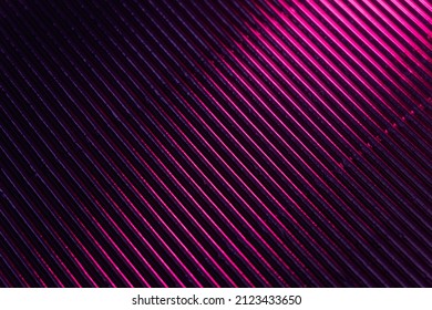 Corrugated texture  Neon light background  Grooved metal surface  Fluorescent pink purple color gradient glow reflection parallel lines pattern dark black abstract overlay 