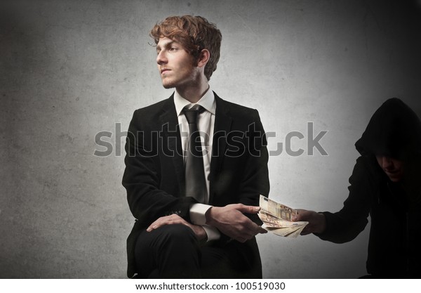 Corrupted Young Businessman Accepting Some Money Stock Photo 100519030