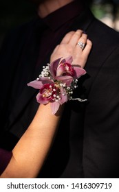 Corsage Against A Black Suit