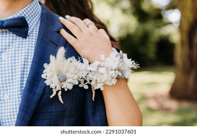 corsage on arm of school leaver