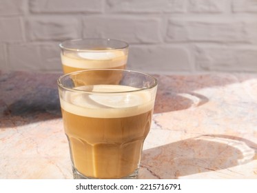 Cortado Coffee In A Glass Glass On A Stone Table. Spanish Coffee	