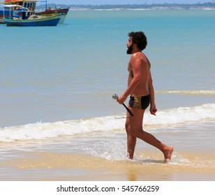 CORUMBAU, BAHIA, BRAZIL, DEC 28, 2916: Man With Go Pro Camera Walking  The Beach In Corumbau, Discovery Coast In Bahia Brazil