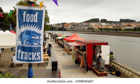 Coruna / Spain - August 31 2019: Fast Food Trucks Lined Up By The River For Local Food Event In El Burgo Coruna Spain