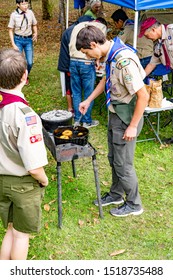 Corvallis, Oregon - 9-28/2019:  A Boy Scout Of Troop One, Boy Scouts Of America, Cooking Dounuts At The Troops 100th Anniversary Celebration.