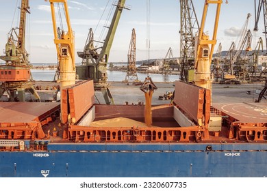 Cose up Black Sea port ukranian grain Loading process of dry cargo ship by harbor cranes. shallow depth of field - Shutterstock ID 2320607735