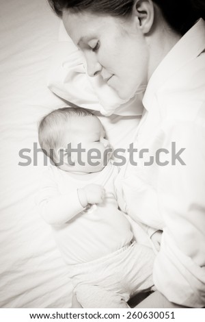 Similar – Mother and cute little baby girl sleeping