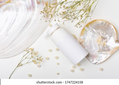 Cosmetic Bottle Containers With Marine Pearl Extraction Essence, Blank Label For Organic Branding Mock-up, Natural Skincare Beauty Product Concept.