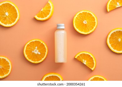 Cosmetic Bottle With Serum And Orange Slices. Flat Lay, Top View.