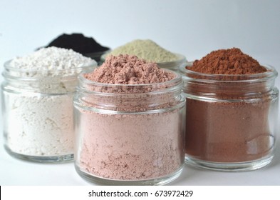 Cosmetic clays for facial beauty face masks - French green clay, pink, red clay, kaolin and powdered activated charcoal
 - Powered by Shutterstock