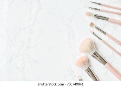 Cosmetic Composition. Pink Brush Set On Marble Table. Cosmetic Dressing Table For Women Make Up Concept. Flat Lay, Top View. Copy Space.