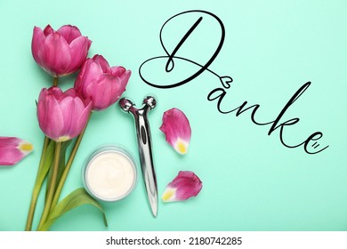 Cosmetic Cream, Face Massage Tool, Flowers And Word DANKE (German For Thanks) On Color Background