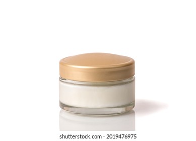 Cosmetic cream in a white jar and a yellow lid. On a white isolated background. - Shutterstock ID 2019476975