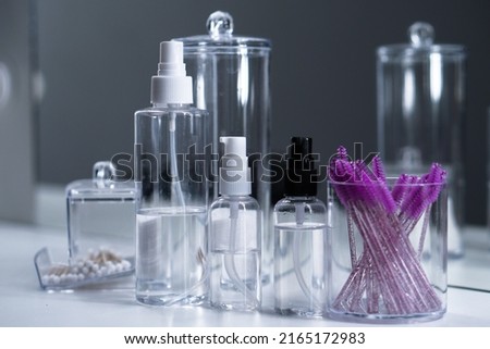 Cosmetic empty bottles and containers. Organizers for cotton swabs and disks. Beauty saloon.