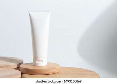 Cosmetic Fashion Cream Lotion Liquid Bottle Tube Product Packaging And Long Shadow On White Background Wood Plate Dish In Beauty Skincare Spa Treatment Healthcare Medical Concept