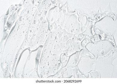 Cosmetic gel or beauty jelly serum texture background. Transparent skin care collagen product backdrop. Antibacterial sanitizer or liquid water moisture toner smudged smear close up photo. - Shutterstock ID 2068292699