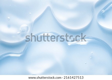 Cosmetic gel or lotion or hyaluronic acid transparent gel drops texture background