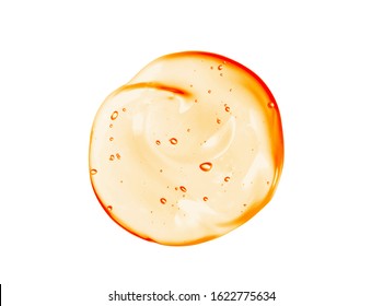 Cosmetic Gel Serum Texture. Transparent Orange Colored Beauty Cream Blob Smear Smudge Isolated On White Background. Skincare Vitamin C Product Swatch With Bubbles Close-up