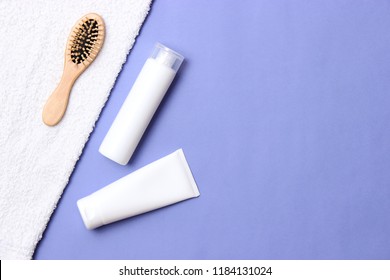 Cosmetic For Hair Care, Comb And Towel On A Colored Background Top View. Flatlay 