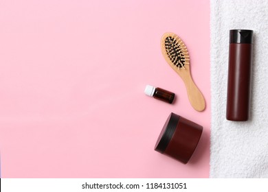 Cosmetic For Hair Care, Comb And Towel On A Colored Background Top View. Flatlay 