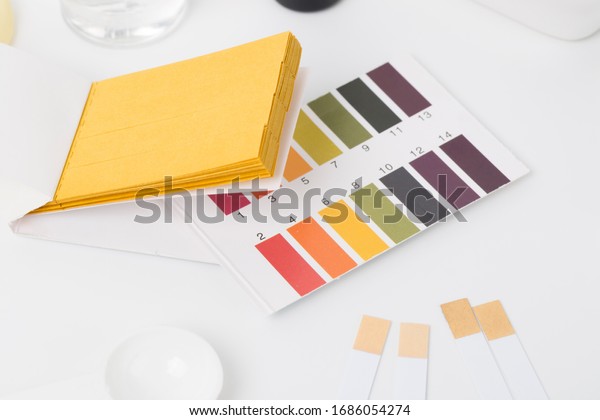 Cosmetic ingredients\
safety testing tools, pH value, water powder value, moisture\
degree, pH test paper, dropper, chemical solvent, and rubber gloves\
in white background	