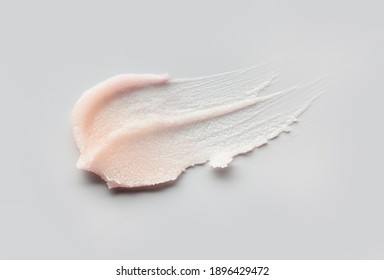Cosmetic lip balm, salt or sugar scrub swatch on gray background