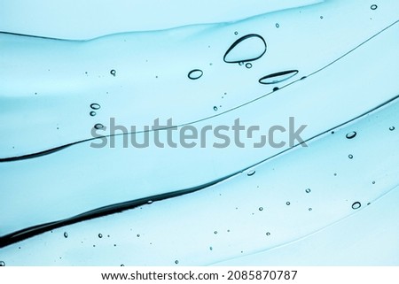 Cosmetic liquid serum or acid peeling or aloe gel textured background swatch isolated on white background
