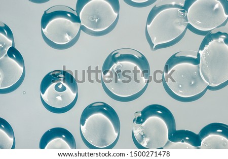 Cosmetic lotion transparent gel drops texture background