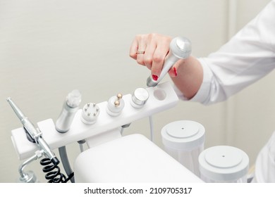 Cosmetic Machine In The Beautician Office. Beautician Holding In His Hands Ice Skin Repairing Treatment Head